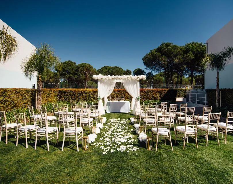 Elopement altar under natural sandstone arches on an Algarve beach